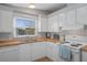 Clean and functional kitchen with white cabinets and wood countertops at 5079 Lodgewood Dr, Lakeland, FL 33810
