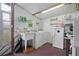 Laundry room with washer, dryer, and utility sink at 5079 Lodgewood Dr, Lakeland, FL 33810
