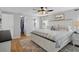 Spacious main bedroom with king-size bed, walk-in closet, and ceiling fan at 5079 Lodgewood Dr, Lakeland, FL 33810