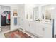 Elegant bathroom with double vanity, walk-in shower, and large closet at 636 Trotters Dr, Eagle Lake, FL 33839