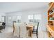 Dining area with a wooden table and access to backyard at 636 Trotters Dr, Eagle Lake, FL 33839