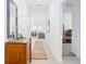 Bright hallway with tile flooring, leading to living areas and bedrooms at 636 Trotters Dr, Eagle Lake, FL 33839