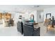 Open concept living area with seating and kitchen views at 636 Trotters Dr, Eagle Lake, FL 33839