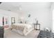Spacious main bedroom with plush carpeting and en suite bathroom at 636 Trotters Dr, Eagle Lake, FL 33839