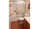 Bathroom with tub, shower, and wood cabinet at 6759 Ashbury Dr, Lakeland, FL 33809