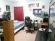 Bedroom with a bed, desk and gaming chair at 6759 Ashbury Dr, Lakeland, FL 33809