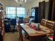 Spacious dining area with a large table and home office area at 6759 Ashbury Dr, Lakeland, FL 33809