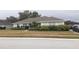 Single-story home with a well-maintained lawn and driveway at 6759 Ashbury Dr, Lakeland, FL 33809