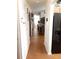 Long hallway with wood-look flooring at 6759 Ashbury Dr, Lakeland, FL 33809