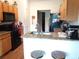 Eat-in kitchen with granite countertops and a breakfast bar at 6759 Ashbury Dr, Lakeland, FL 33809