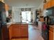 Kitchen with granite countertops, wood cabinets, and modern appliances at 6759 Ashbury Dr, Lakeland, FL 33809