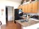 Galley kitchen with granite countertops and stainless steel appliances at 6759 Ashbury Dr, Lakeland, FL 33809