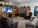 Spacious living room featuring comfortable seating and a built-in entertainment center at 6759 Ashbury Dr, Lakeland, FL 33809