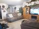 Bright living room with ample seating and access to other areas of the home at 6759 Ashbury Dr, Lakeland, FL 33809
