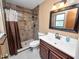 Bathroom with shower, vanity, and tile flooring at 6929 Farris Dr, Lakeland, FL 33811