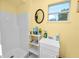 Clean bathroom with shower, sink, and decorative accents at 6929 Farris Dr, Lakeland, FL 33811