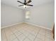 Bedroom with tile floor and ceiling fan at 6929 Farris Dr, Lakeland, FL 33811