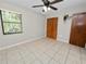Bedroom with tile floors and ceiling fan at 6929 Farris Dr, Lakeland, FL 33811