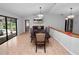 Spacious dining room with a large table, chandelier, and pool view at 6929 Farris Dr, Lakeland, FL 33811
