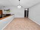 Spacious dining room with tile floors and a crystal chandelier at 6929 Farris Dr, Lakeland, FL 33811