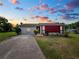 One-story home with a red accent wall and a spacious yard at 6929 Farris Dr, Lakeland, FL 33811