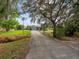 Ranch-style home with a long driveway at 6929 Farris Dr, Lakeland, FL 33811