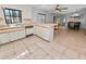 Kitchen with breakfast bar, stainless steel appliances, and view to dining area at 6929 Farris Dr, Lakeland, FL 33811