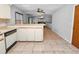 Kitchen area with a breakfast bar and view of the dining room at 6929 Farris Dr, Lakeland, FL 33811