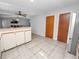 Kitchen features white cabinets, stainless steel appliances, and tile floors at 6929 Farris Dr, Lakeland, FL 33811