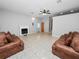 Open living room with tile floors and a fireplace at 6929 Farris Dr, Lakeland, FL 33811