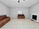 Spacious living room featuring a fireplace and tile flooring at 6929 Farris Dr, Lakeland, FL 33811