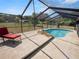 Relaxing pool with screened enclosure and chaise lounge at 6929 Farris Dr, Lakeland, FL 33811