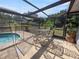 Screened pool and patio area with seating for lounging at 6929 Farris Dr, Lakeland, FL 33811