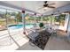 Screened patio with pool, table and chairs for outdoor dining at 6929 Farris Dr, Lakeland, FL 33811