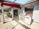 Outdoor kitchen and screened poolside patio at 6929 Farris Dr, Lakeland, FL 33811