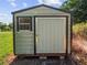 Metal storage shed with double doors and window at 6929 Farris Dr, Lakeland, FL 33811