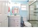 Clean bathroom with white vanity and walk-in shower at 726 Erie Ct, Lakeland, FL 33803