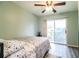 Serene bedroom with sliding glass door to patio access at 726 Erie Ct, Lakeland, FL 33803