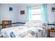 Cozy bedroom with a comfortable bed and leafy bedding at 726 Erie Ct, Lakeland, FL 33803