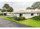 White single story home with landscaped yard at 726 Erie Ct, Lakeland, FL 33803