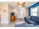 Open living room showcasing a comfy sectional sofa and ceiling fan at 726 Erie Ct, Lakeland, FL 33803