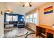 Living room with a desk area and an open view to other rooms at 726 Erie Ct, Lakeland, FL 33803