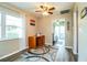 Home office with wood desk and access to bedroom at 726 Erie Ct, Lakeland, FL 33803