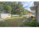 Fenced backyard with shed and patio area at 8309 Porch Ct, Lakeland, FL 33810