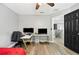 Bedroom with desk and two monitors, hardwood floor at 8309 Porch Ct, Lakeland, FL 33810