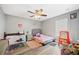 Bedroom with twin bed, ceiling fan and hardwood floors at 8309 Porch Ct, Lakeland, FL 33810