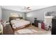 Spacious bedroom with wood-look floors and ceiling fan at 8309 Porch Ct, Lakeland, FL 33810