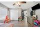 Bedroom with double bed, dresser, and ceiling fan at 8309 Porch Ct, Lakeland, FL 33810