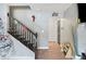 Interior staircase with dark wood and white railings at 8309 Porch Ct, Lakeland, FL 33810
