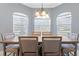 Elegant dining room featuring a wood table and ample natural light at 1010 Crossroads Dr, Polk City, FL 33868